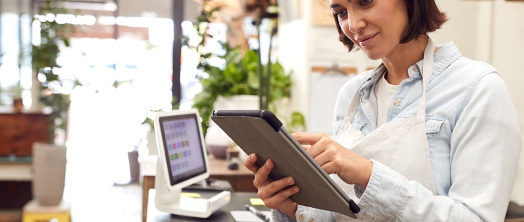 business owner viewing her tablet